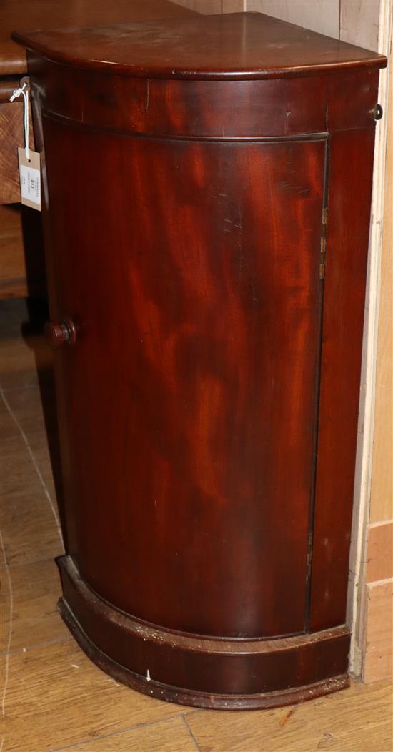 A mahogany bow fronted corner hanging cabinet W.42cm